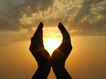 Hands upraised in conscious contact